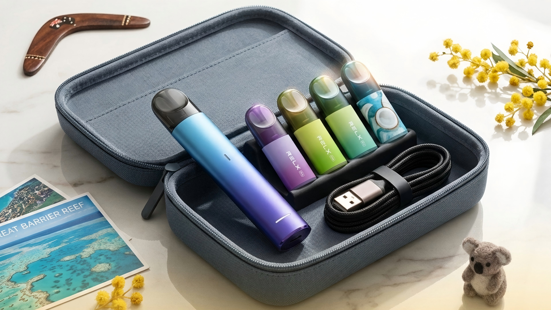 RELX Essential 2 device with multiple pods packed in travel case, USB-C cable visible