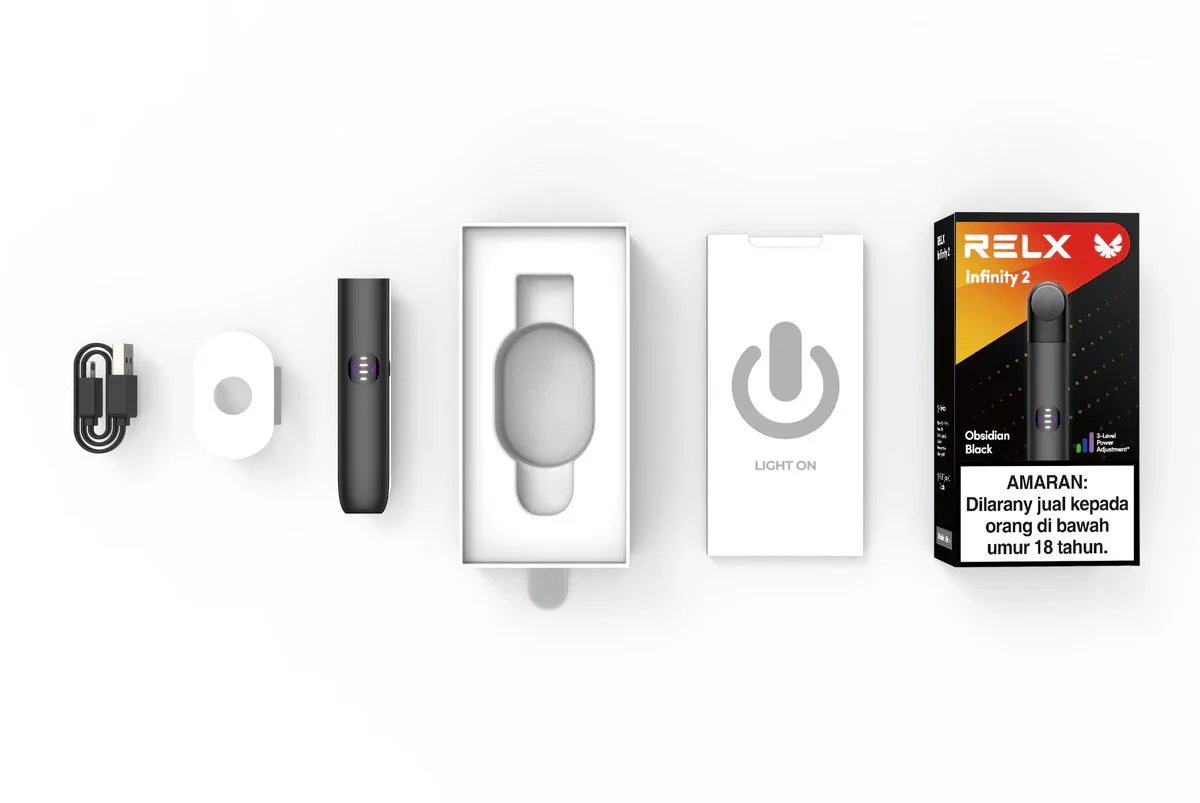Closed pod vape system with device, charging cable, and sealed pre-filled pods displayed